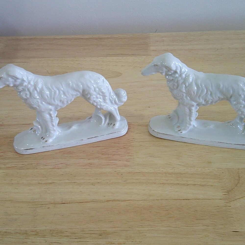 Pair of ceramic wolfhound figurines.  4 1/2 In. tall X 5 1/2 in. long